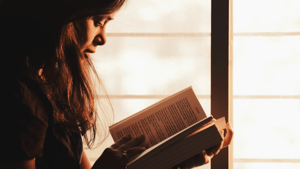 A woman reading is a good example of coping from anxiety